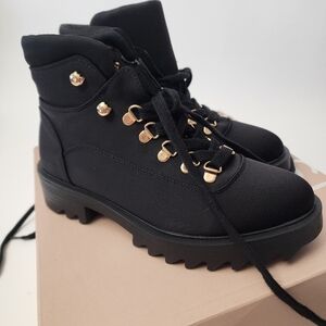 Black hiking combat boots with gold metal JustFab